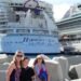harmony of the seas cruise ship docked in port and a family of three in front of the ship. Mom and two younger teens