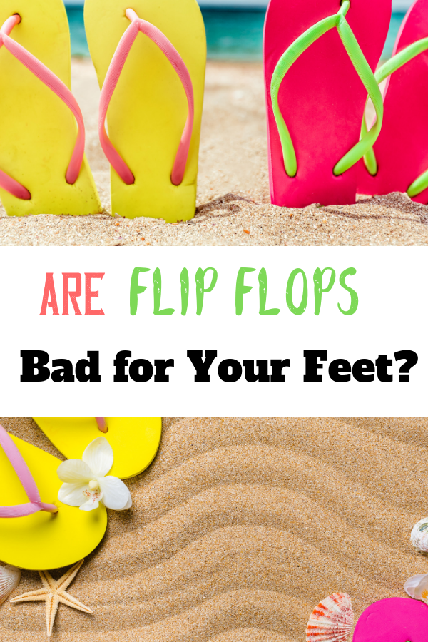 cute colourful flip flops lined up on sand