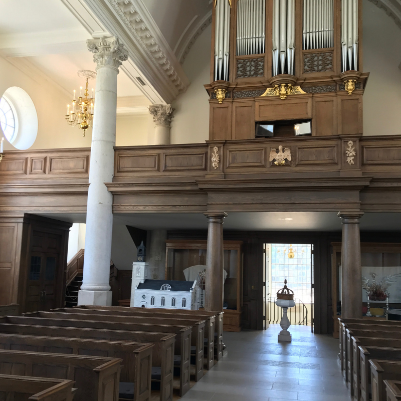 St. Mary the Virgin, Aldermanbury Church in Fulton Missouri. Inside the church showing ornate columns and rows of seats as well as the organ in balcony area