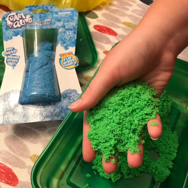 sensory_toy_green_foam_alive_in_a_girls_hand