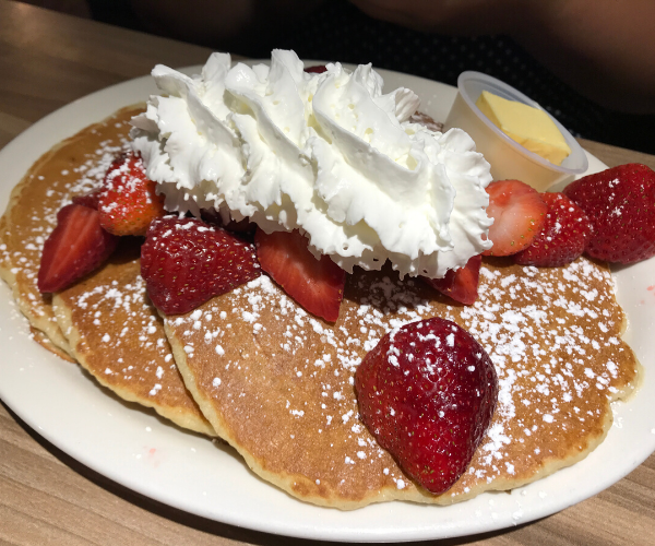 pancakes_loaded_with_strawberries_andwhipped_cream_jines_restaurant_rochester_new_york