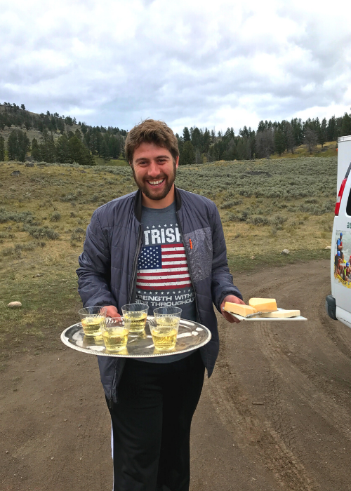 Austin adventures tour guide holding a silver platter with wine and cheese