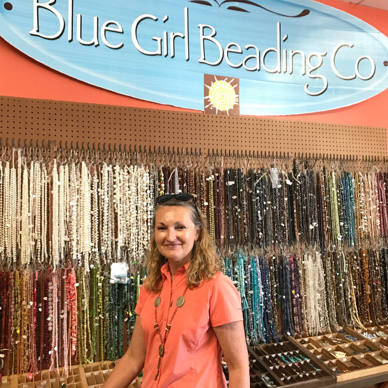 blue_girl_beading_wall_of_beads