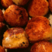 cheese ball appetizer coated with breading and browned perfectly