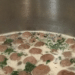 Italian wedding soup meatballs boiling in a large pot on the stove