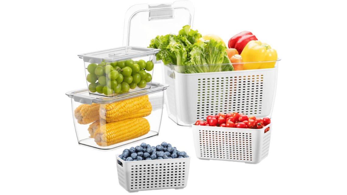 food storage containers full of bright fruits and vegetables. See through oblong containers of various sizes with plastic shelf inside that has holes and