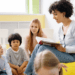 teacher reading to kids in a small classroom