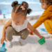 kids playing in a sandbox with what looks like little cars